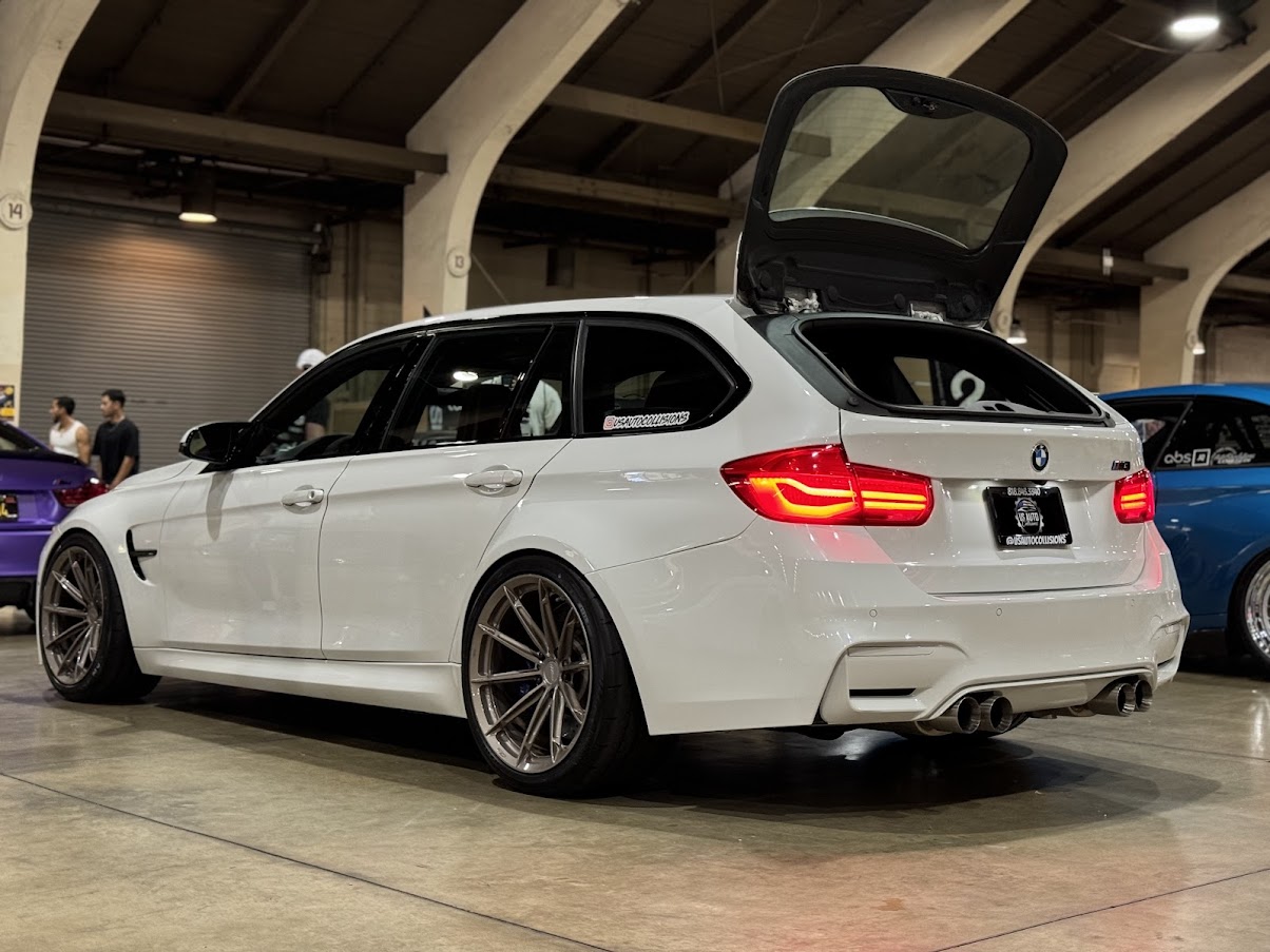 Rear angle BMW F81 Touring restored at US Auto Collisions auto body shop in Burbank California