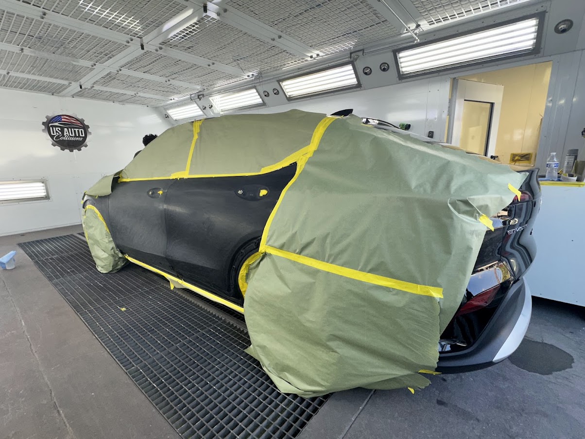 Vehicle Refinish Work Inside US Auto Collision Center Paint Booth Vehicle masked for refinishing inside the US Auto Collision Center paint booth in Burbank
